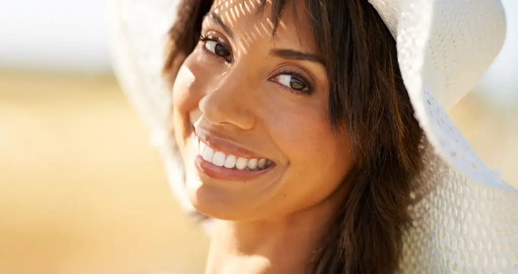 Smiling woman with long dark hair