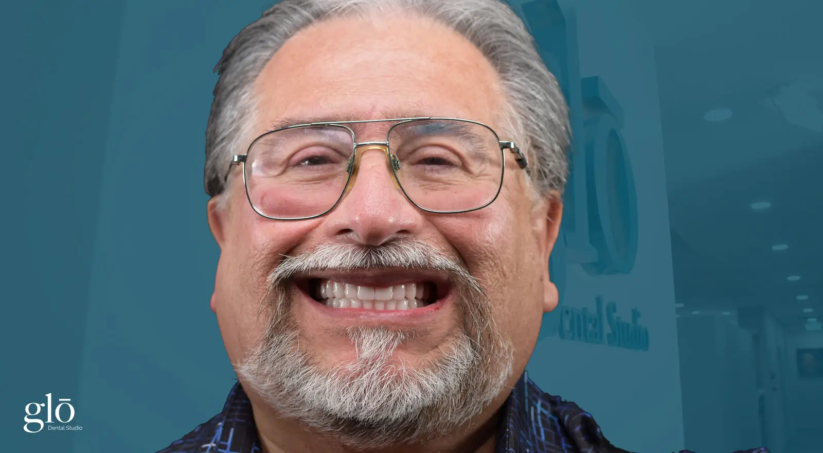 Patient smiling after implant treatment