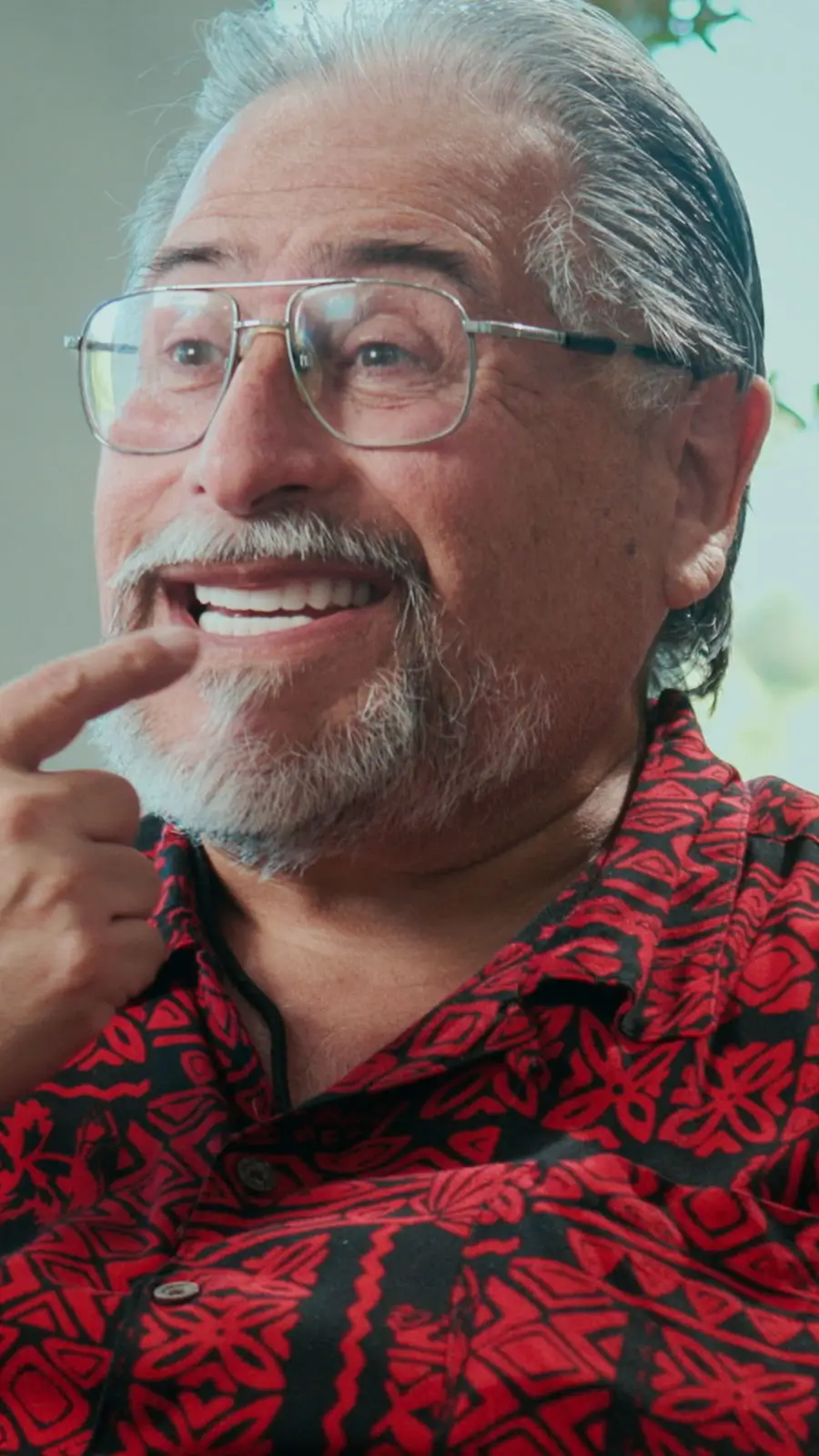 Patient pointing at his new smile
