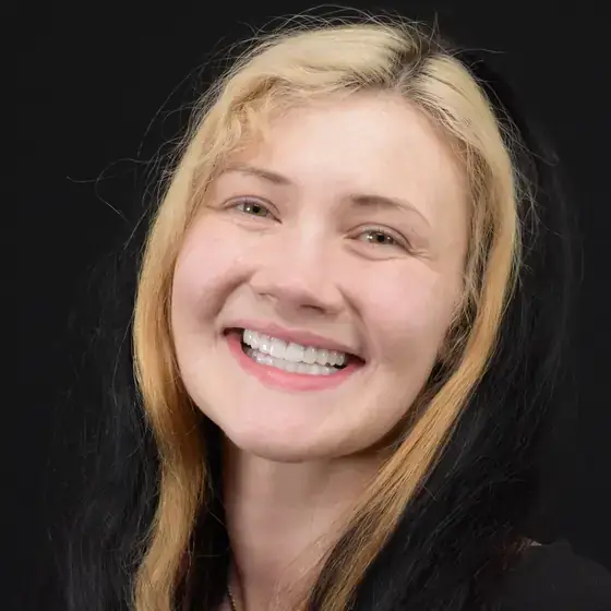 Patient after a smile makeover at Glō Dental Studio